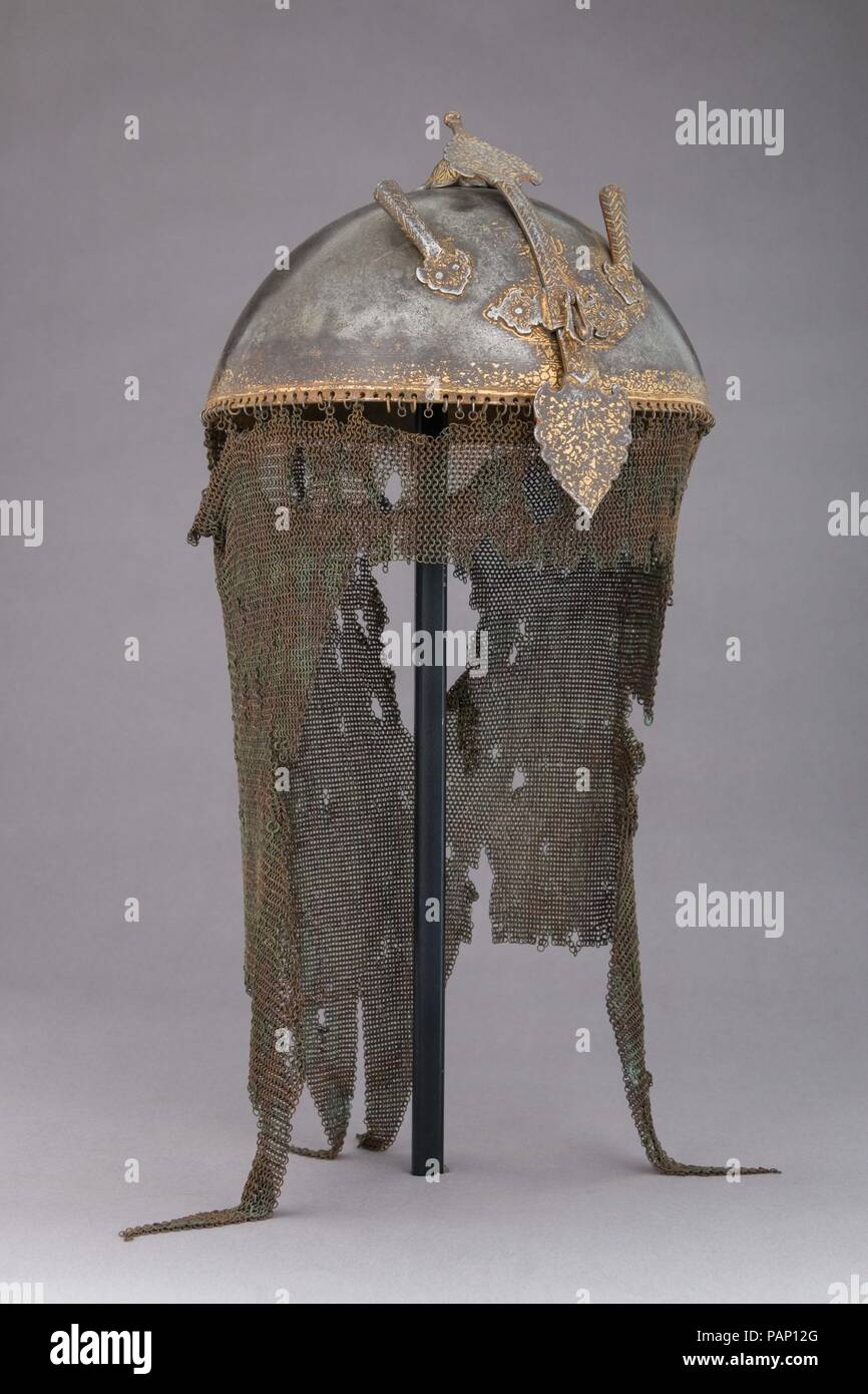 Helmet, Cuirass, and Pair of Arm Defenses. Culture: Persian. Dimensions: H. including mail 19 in. (48.3 cm); H. including nasal 9 in. (22.9 cm); H. excluding mail and nasal 5 in. (12.7 cm); W. 7 3/4 in. (19.7 cm); D. 8 1/4 in. (21 cm); Wt. 2 lb. 1.9 oz. (961 g). Date: 17th-18th century. Museum: Metropolitan Museum of Art, New York, USA. Stock Photo