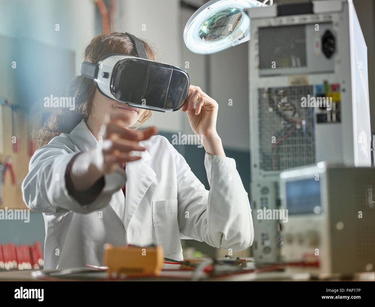 female engineer using virtual reality headset Stock Photo