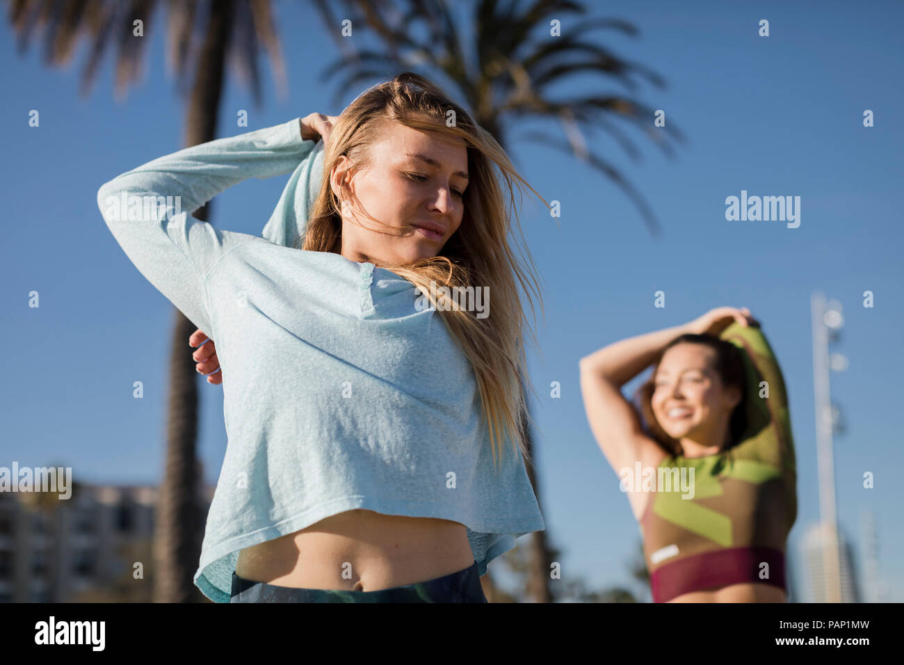 Women stretching arms hi-res stock photography and images - Alamy