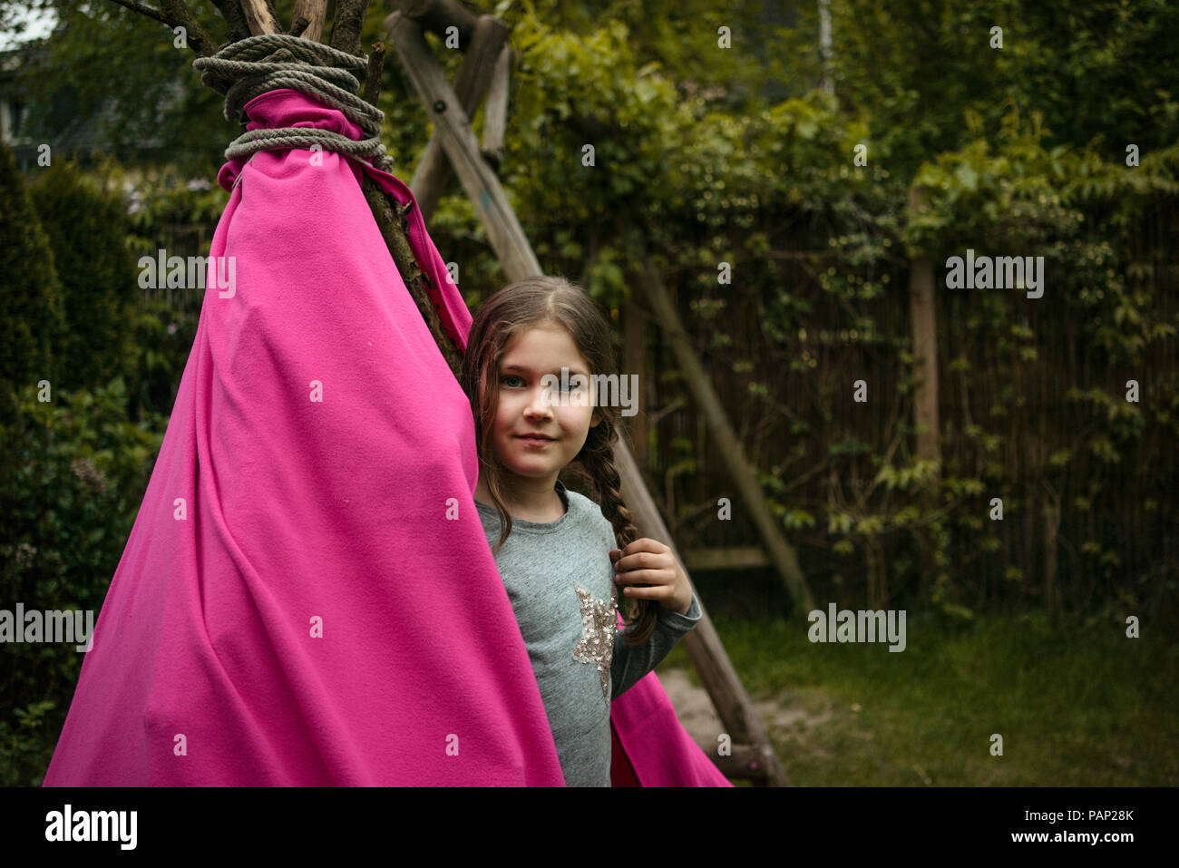 Smiling girl with braid, tipi Stock Photo