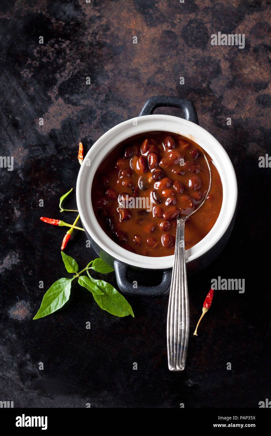 Tureen of black bean soup with chili pepper Stock Photo