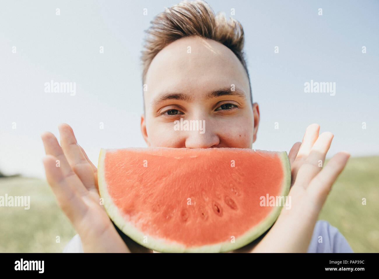 Melon head man holding melon hires stock photography and images Alamy