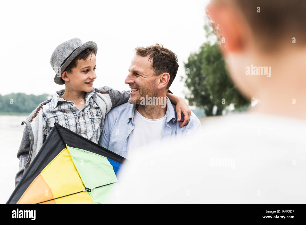 Two boys with arms around each other hi-res stock photography and ...