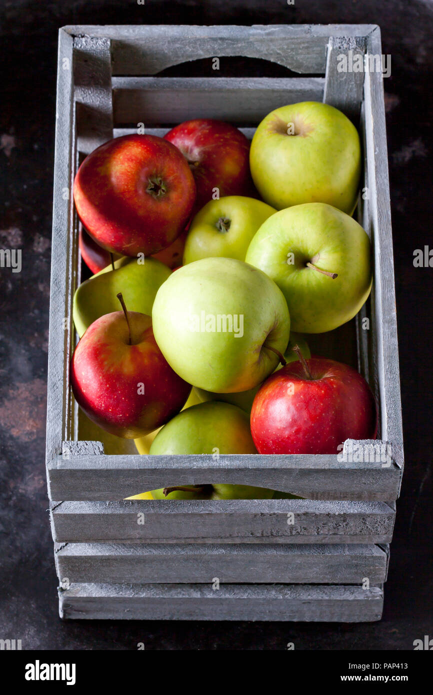 Grey wooden box of apples Stock Photo - Alamy