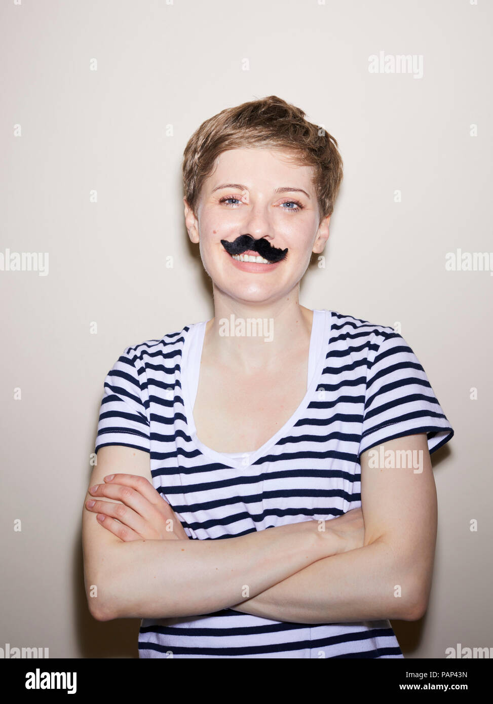 Portrait of blond woman, short hair, moustache Stock Photo