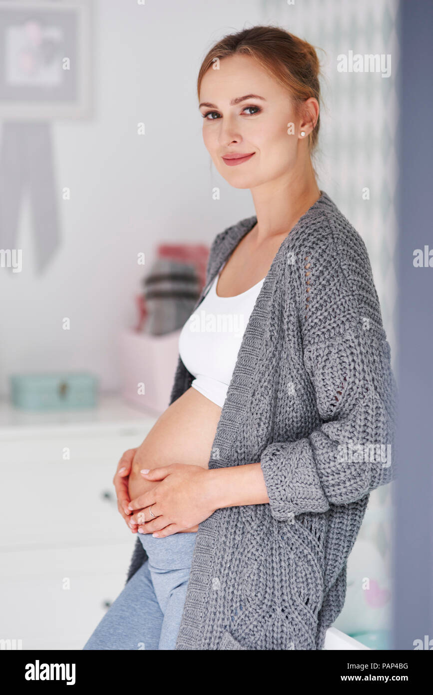Pregnant woman holding baby belly Stock Photo