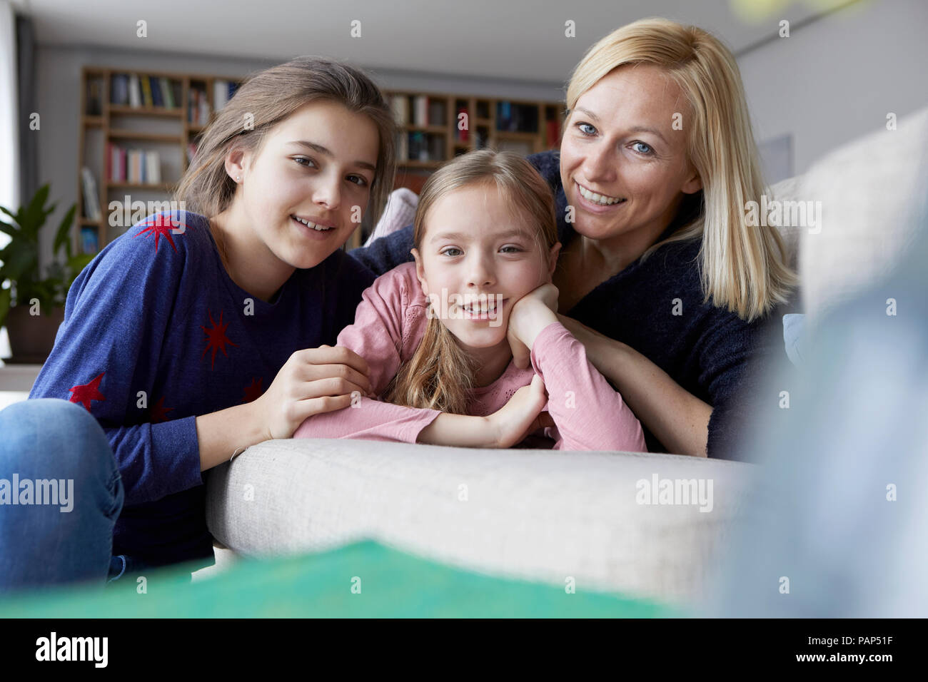 Mother and daughters having fun at home Stock Photo