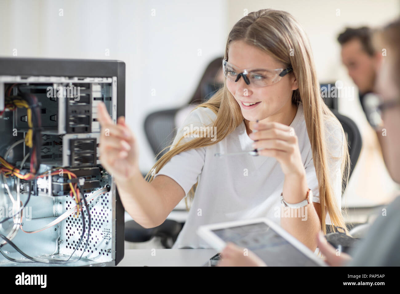 Students assembling computer in class Stock Photo