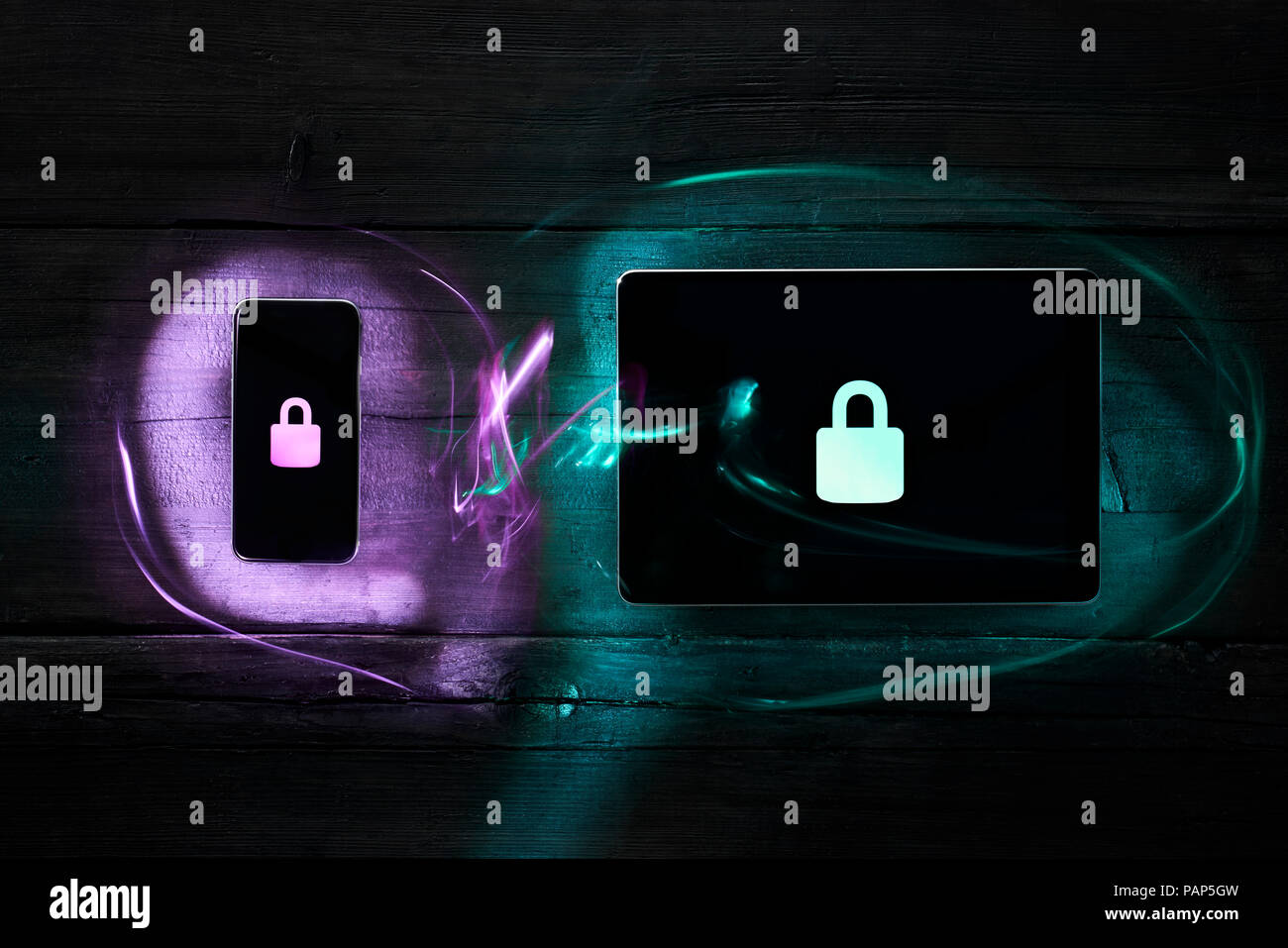 Locks on smartphone and digital tablet, data encryption Stock Photo