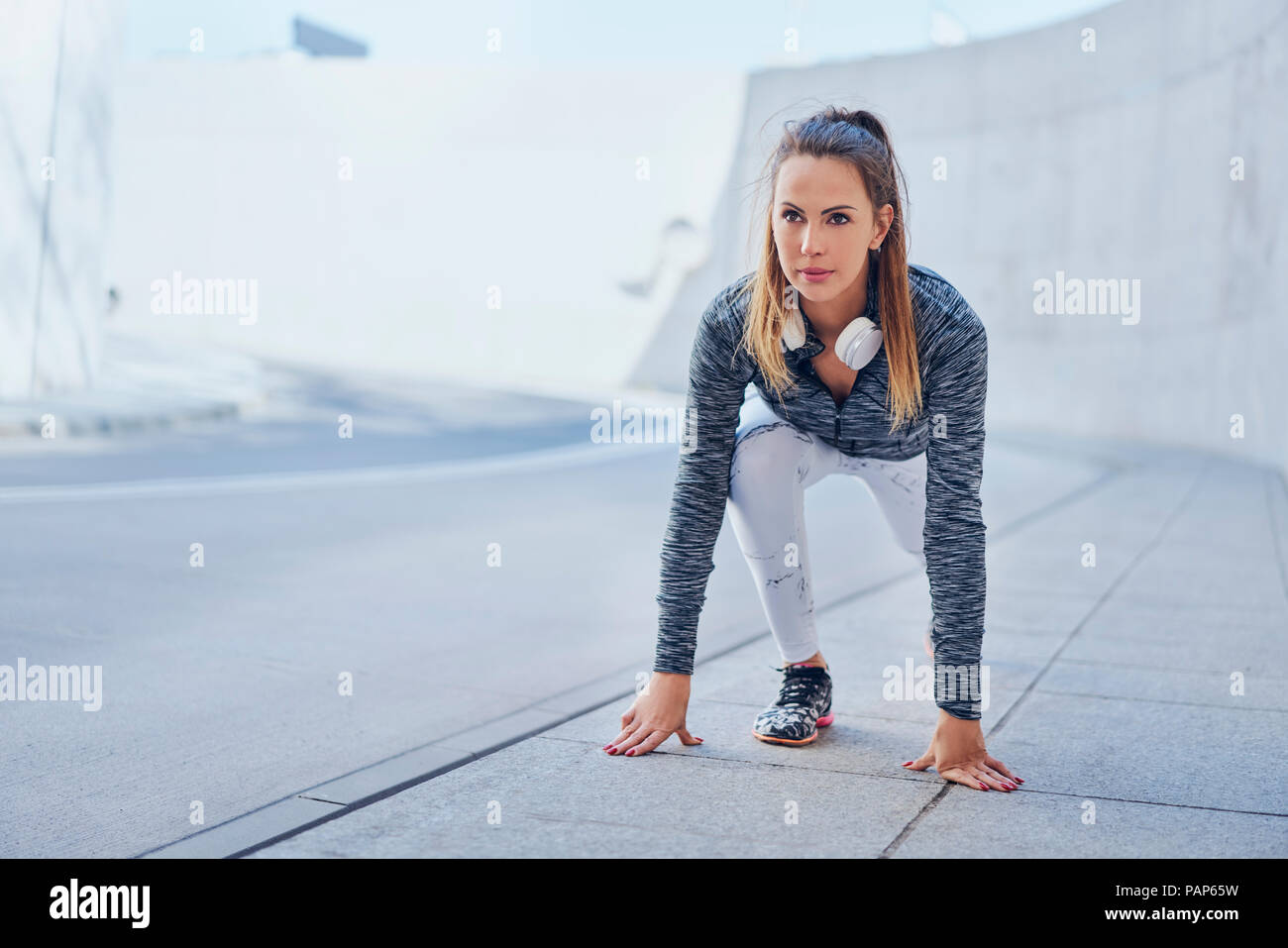 Woman stretching leg after jogging Stock Photo