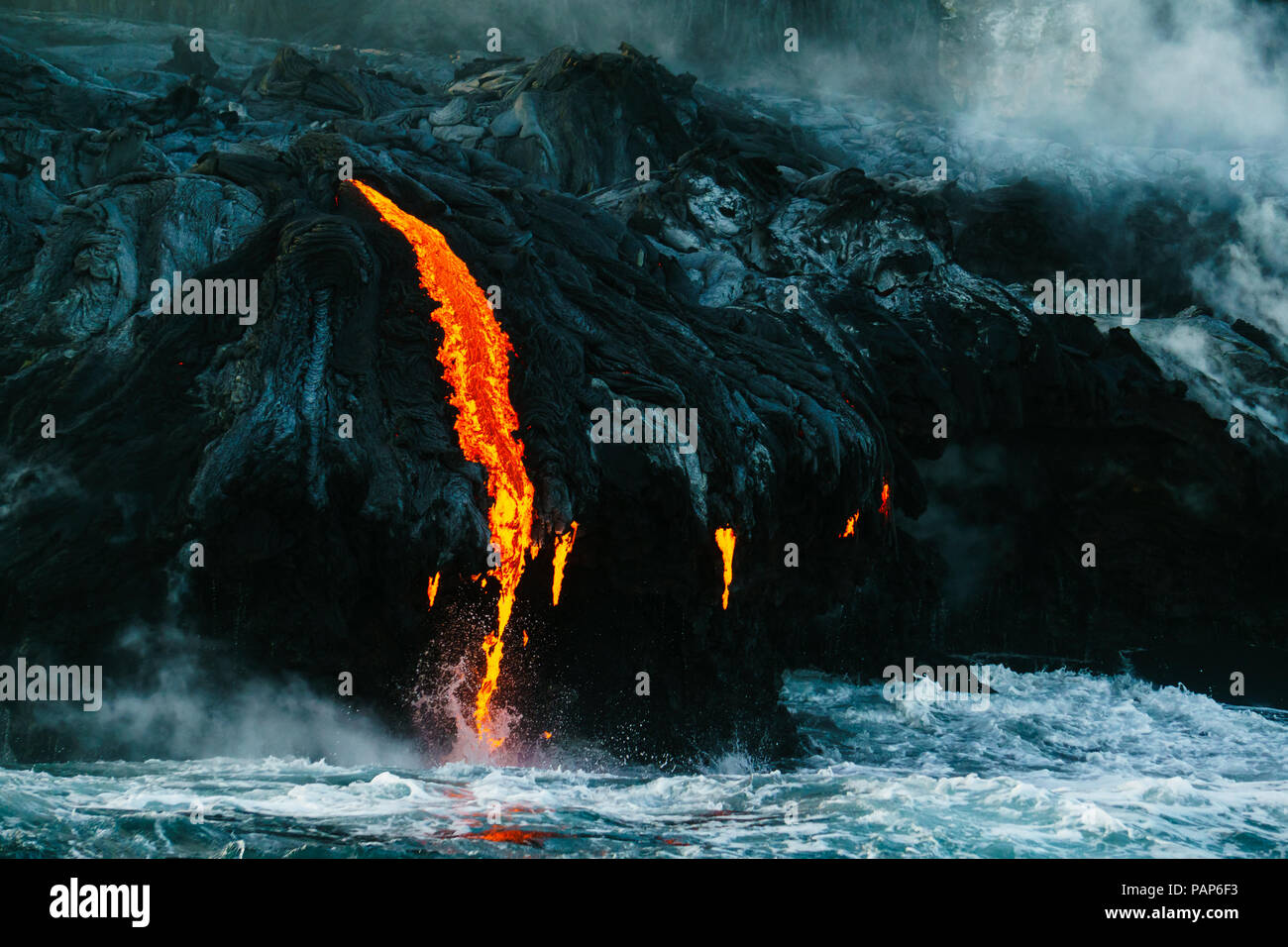 Lava flow meets sea water hi-res stock photography and images - Alamy