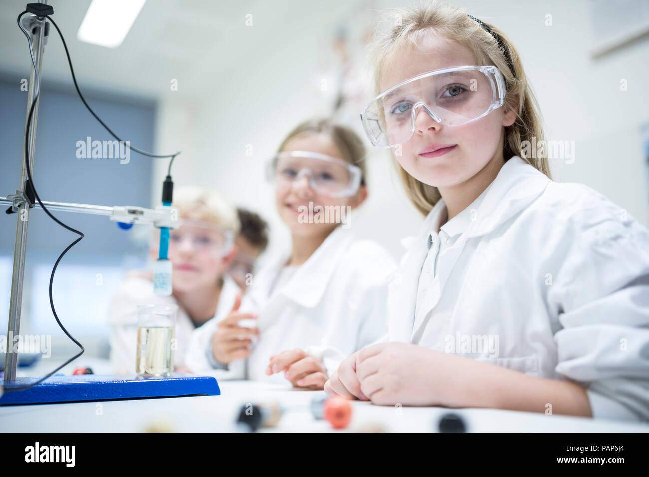 Pupils in science class experimenting Stock Photo