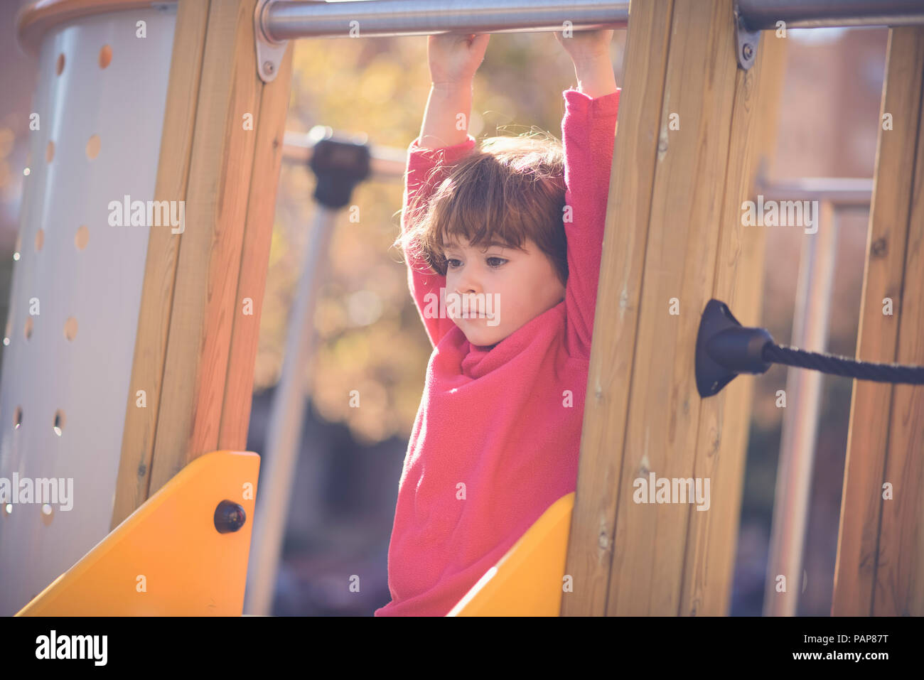 Portrait of pensive little girl on   playground Stock Photo