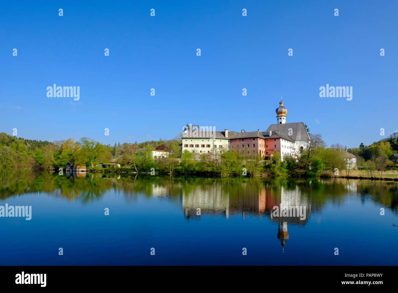Germany, Bavaria, Upper Bavaria, Chiemgau, Rupertigau, Rupertiwinkel, Anger, View to former Hoeglwoerth Abbey and lake Stock Photo
