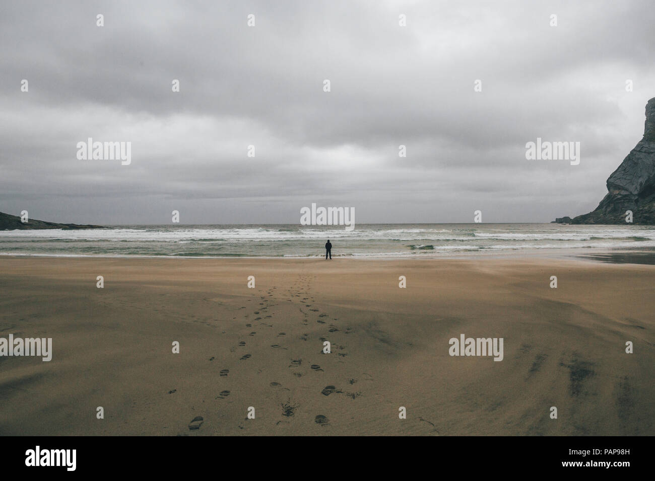 Lonely man standing bunes beach hi-res stock photography and images - Alamy