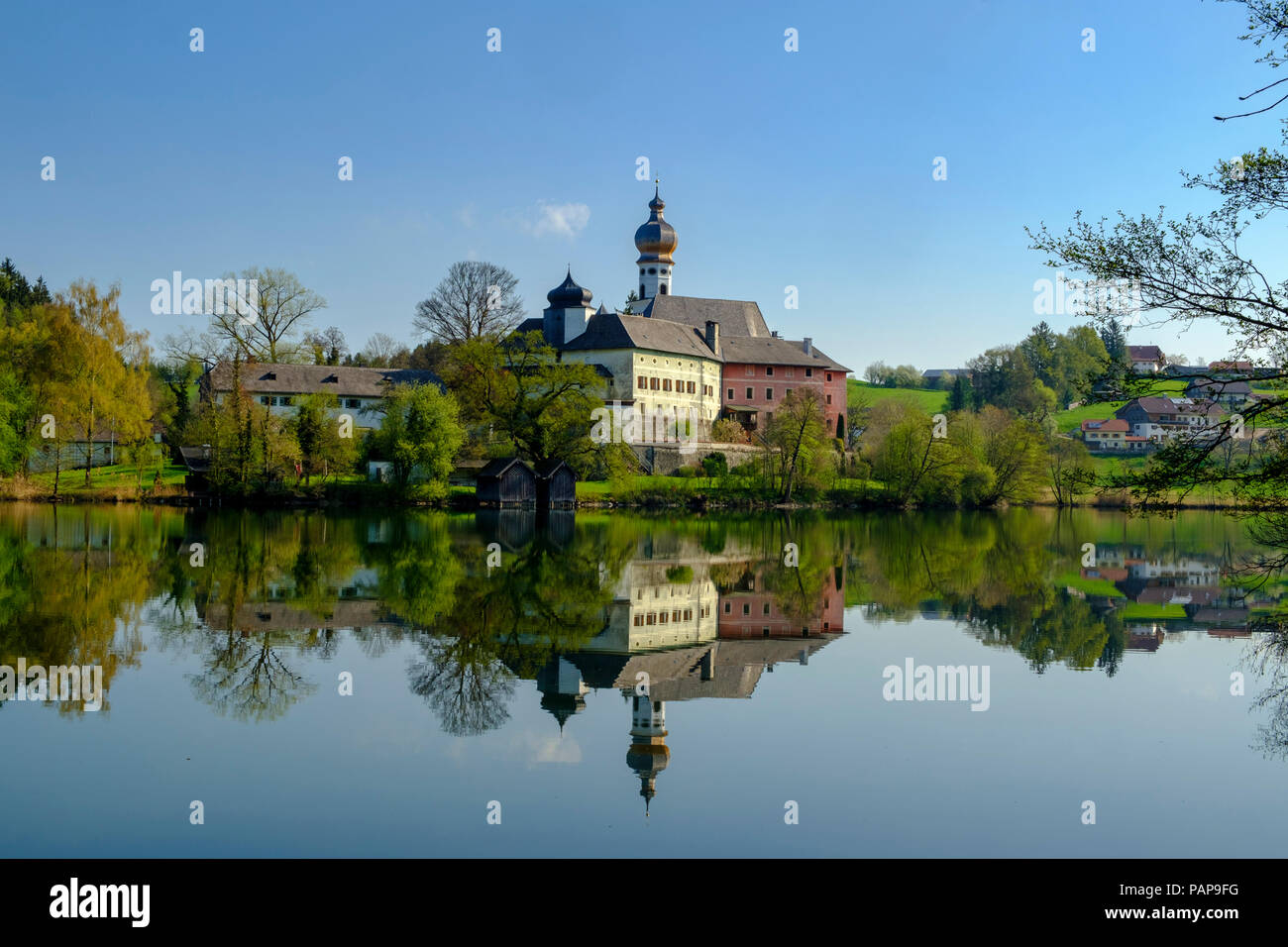 Germany, Bavaria, Upper Bavaria, Chiemgau, Rupertigau, Rupertiwinkel, Anger, View to former Hoeglwoerth Abbey and lake Stock Photo