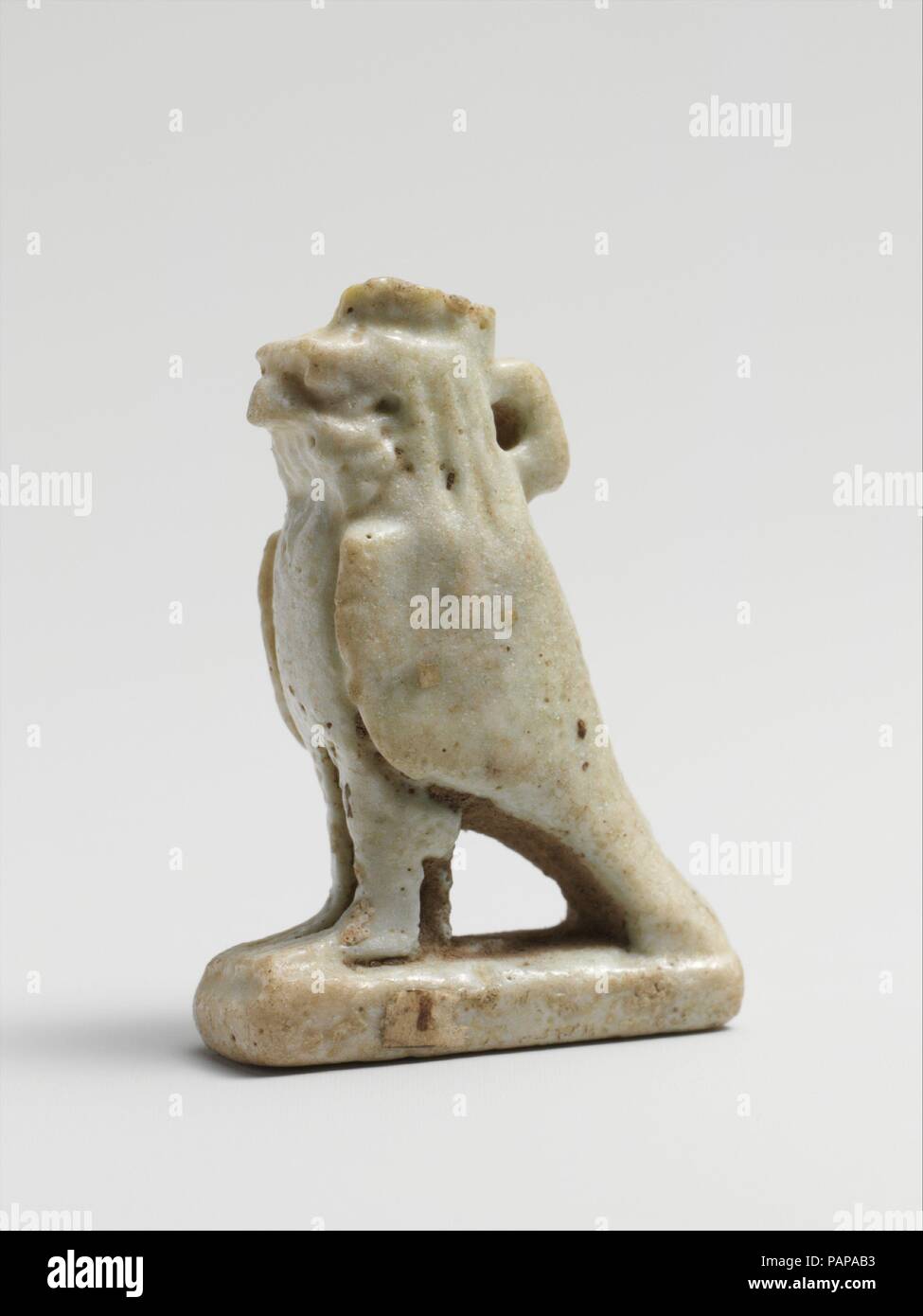 Faience amulet of Ra Horakhty. Culture: Egyptian. Dimensions: H.: 1 1/4 in. (3.2 cm). Date: 664-30 B.C..  Amulets representing animals were attributed to a deity: a hawk for Ra, the Sun God, a lion for Sakhmi, the War Goddess, a ram for Khnum and a cat for Bast. Museum: Metropolitan Museum of Art, New York, USA. Stock Photo
