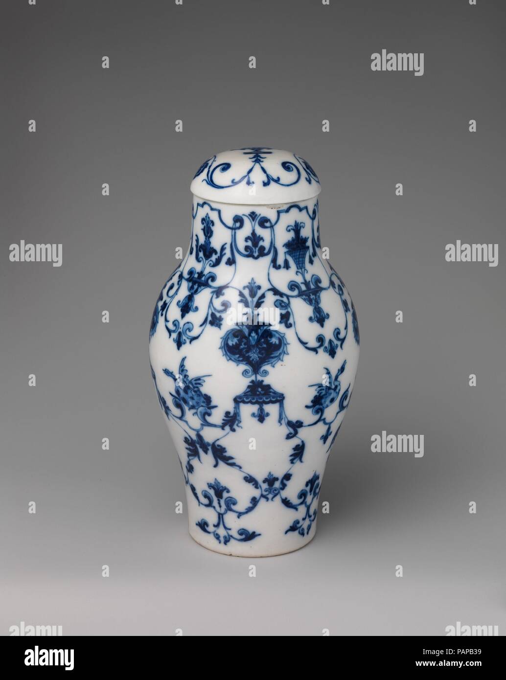 vase with cover culture french saint cloud dimensions overall confirmed 9 1516 x 5 14 x 5 316 in 252 x 133 x 132 cm factory saint cloud factory french before 1698 1766 date ca 1695 1710 of chinese inspiration both in its form and blue and white color scheme the jar is painted in a manner that bines renaissance grotesque elements based on etchings by jacques androuet du cerceau ca with the contemporary designs by jean berain 1637 1711 museum metropolitan museum of art new york usa image