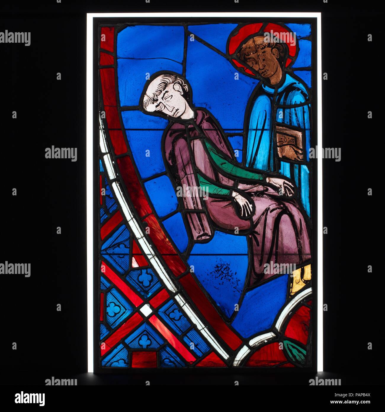 Vision of Saint Germain of Paris. Culture: French. Dimensions: Overall: 25 1/8 x 15 3/4 in. (63.8 x 40 cm). Date: 1245-47.  This panel is one of two scenes from the Legend of Saint Germain of Paris.  Here Germain appears posthumously in a dream to a monk from Saint-Germain-des-Prés, exhorting the brother to maintain his faith. The figures dominate the compositions, fully commanding the dark blue ground against which they are placed. Details of the setting are minimal, lending a sense of the otherworldly to the vision, and forms are suggested by color masses, contrast of tone, and painted line. Stock Photo