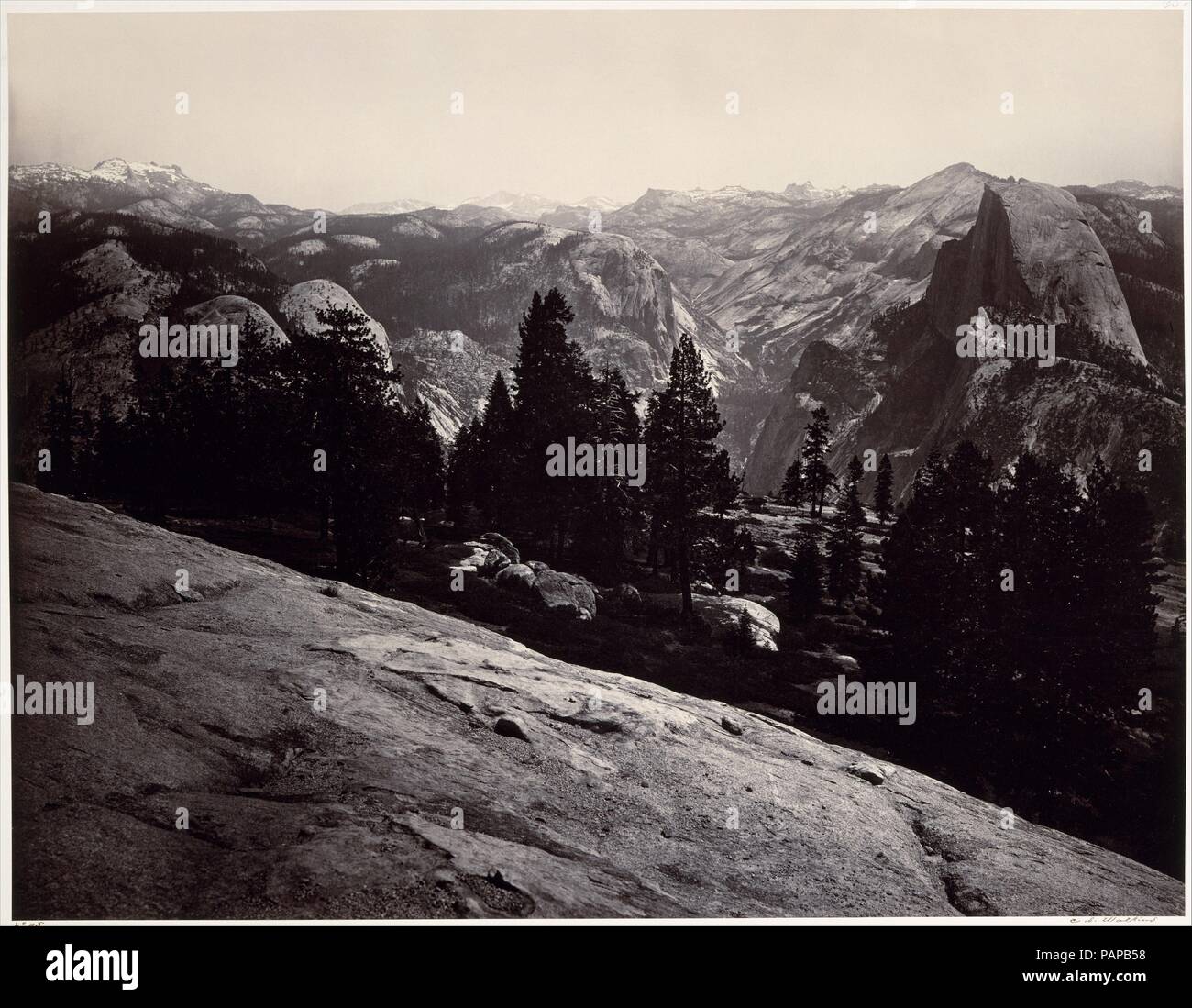 View from the Sentinel Dome, Yosemite. Artist: Carleton E. Watkins (American, 1829-1916). Dimensions: Image 1: 40.3 × 52.1 cm (15 7/8 × 20 1/2 in.)  Mount 1: 53.4 x 68.7cm (21 x 27 1/16in.)  Image 2: 40.0 x 52.5 cm (15 3/4 x 20 11/16 in.)  Mount 2: 53.3 x 68.8cm (21 x 27 1/16in.)  Image 3: 40.8 x 52.5cm (16 1/16 x 20 11/16in.)  Mount 3: 53.2 x 68.7cm (20 15/16 x 27 1/16in.). Date: 1865-66.  Carleton Watkins made his name with views of Yosemite Valley, which he photographed repeatedly over a twenty-year period, beginning in 1861. By that time, he was a virtuoso practitioner of the difficult wet Stock Photo