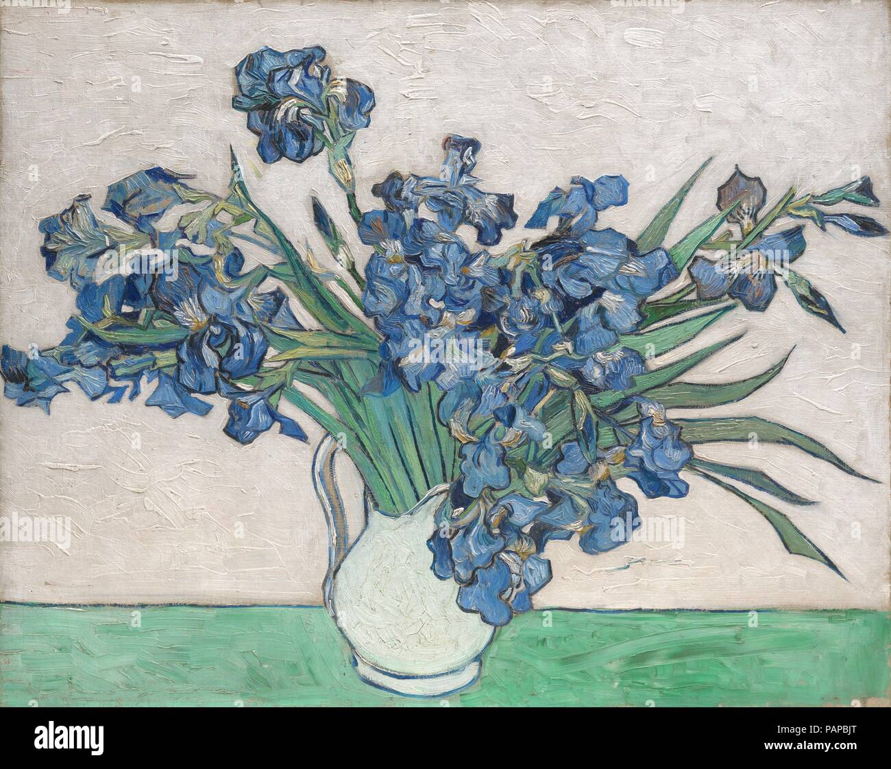 Irises. Artist: Vincent van Gogh (Dutch, Zundert 1853-1890 Auvers-sur-Oise). Dimensions: 29 x 36 1/4 in. (73.7 x 92.1 cm). Date: 1890.  In May 1890, just before he checked himself out of the asylum at Saint-Rémy, Van Gogh painted four exuberant bouquets of spring flowers, the only still lifes of any ambition he had undertaken during his yearlong stay: two of irises, two of roses, in contrasting color schemes and formats. In the Museum's <i>Irises</i> he sought a 'harmonious and soft' effect by placing the 'violet' flowers against a 'pink background,' which have since faded owing to his use of  Stock Photo