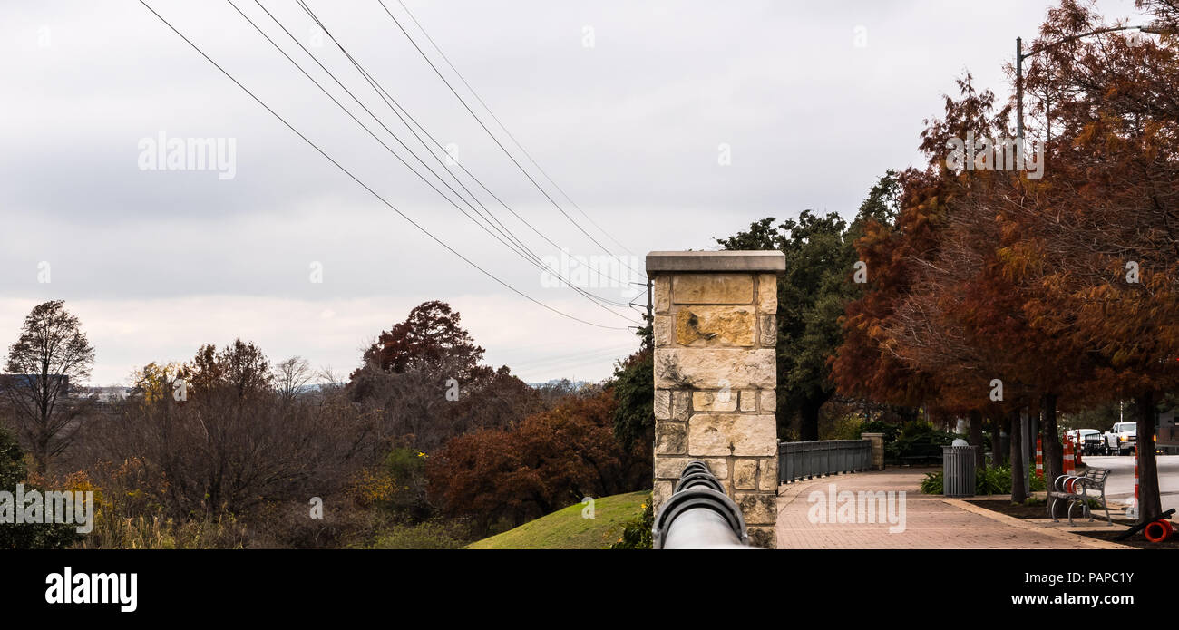View of a part of the Ann and Roy - View Of A Part Of The Ann And Roy Butler Hike And Bike Trail To The Left And The Beginning Of Downtown Austin Texas On The Right PAPC1Y 