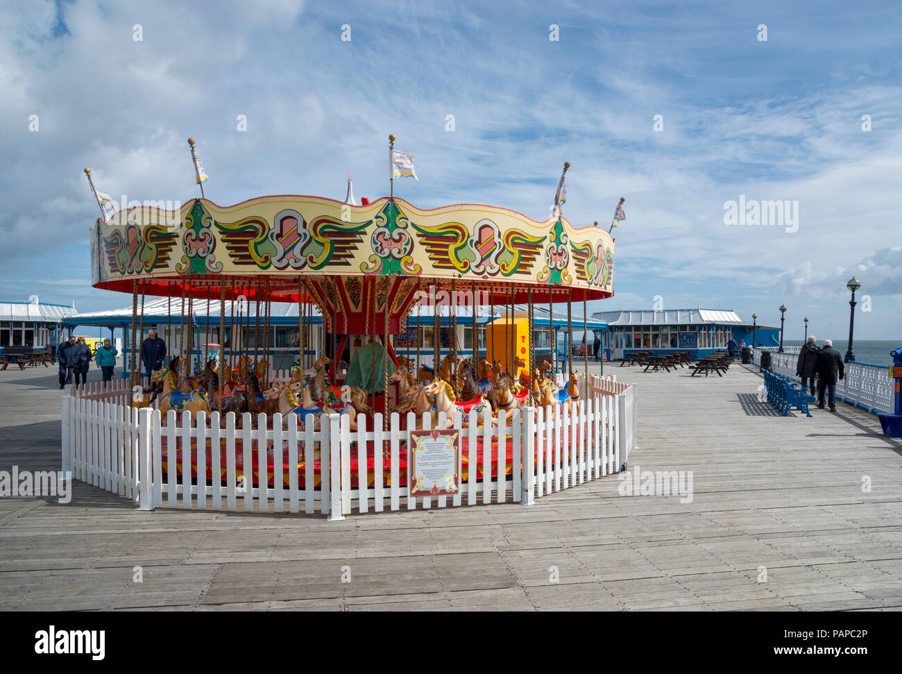 Colourful old carousel at the ed of the pier at Llandudno, North Wales, UK. Stock Photo