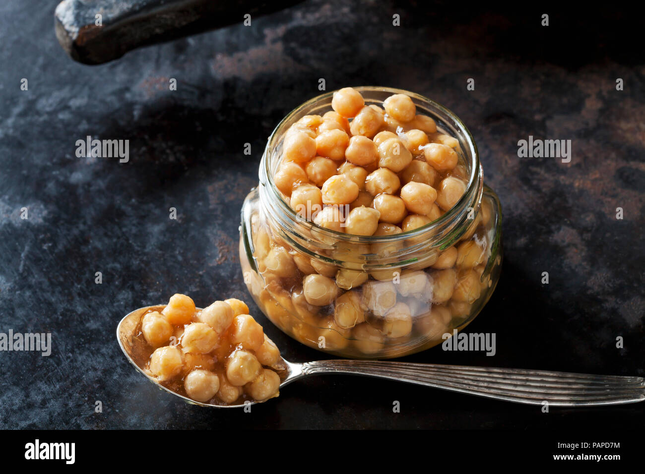 Glass of preserved chickpeas Stock Photo