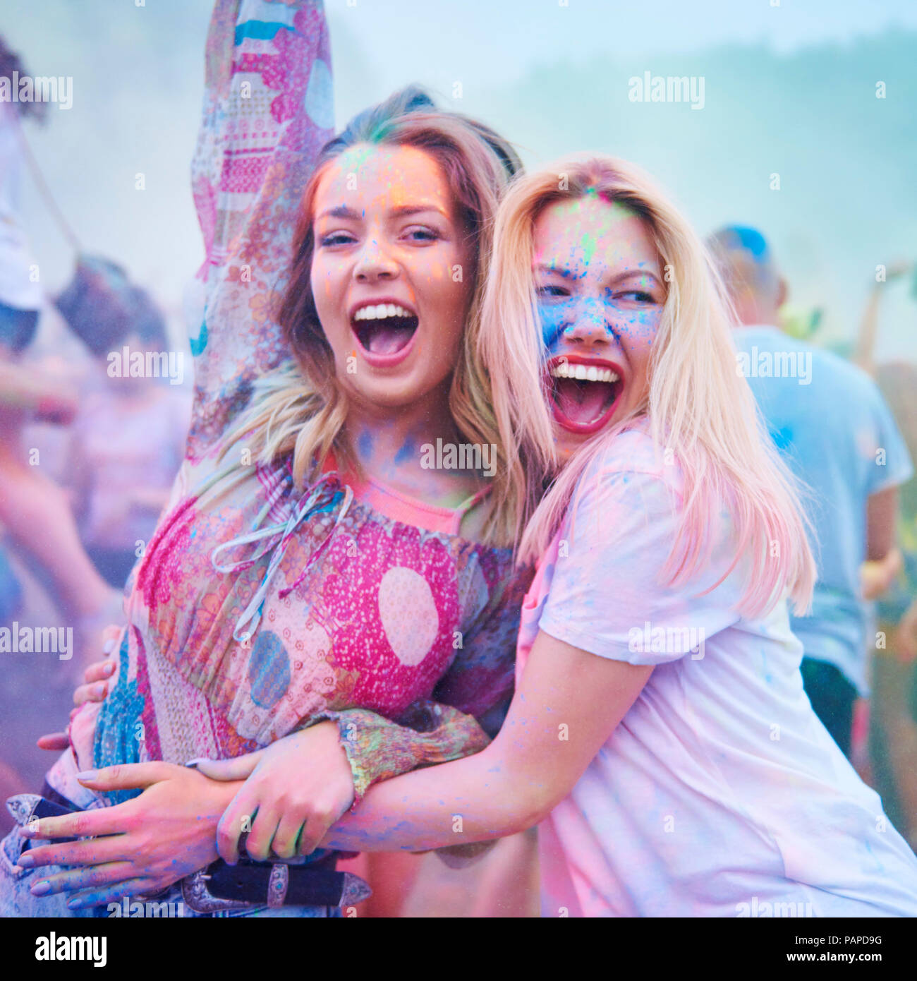 Friends dancing together at music festival Stock Photo