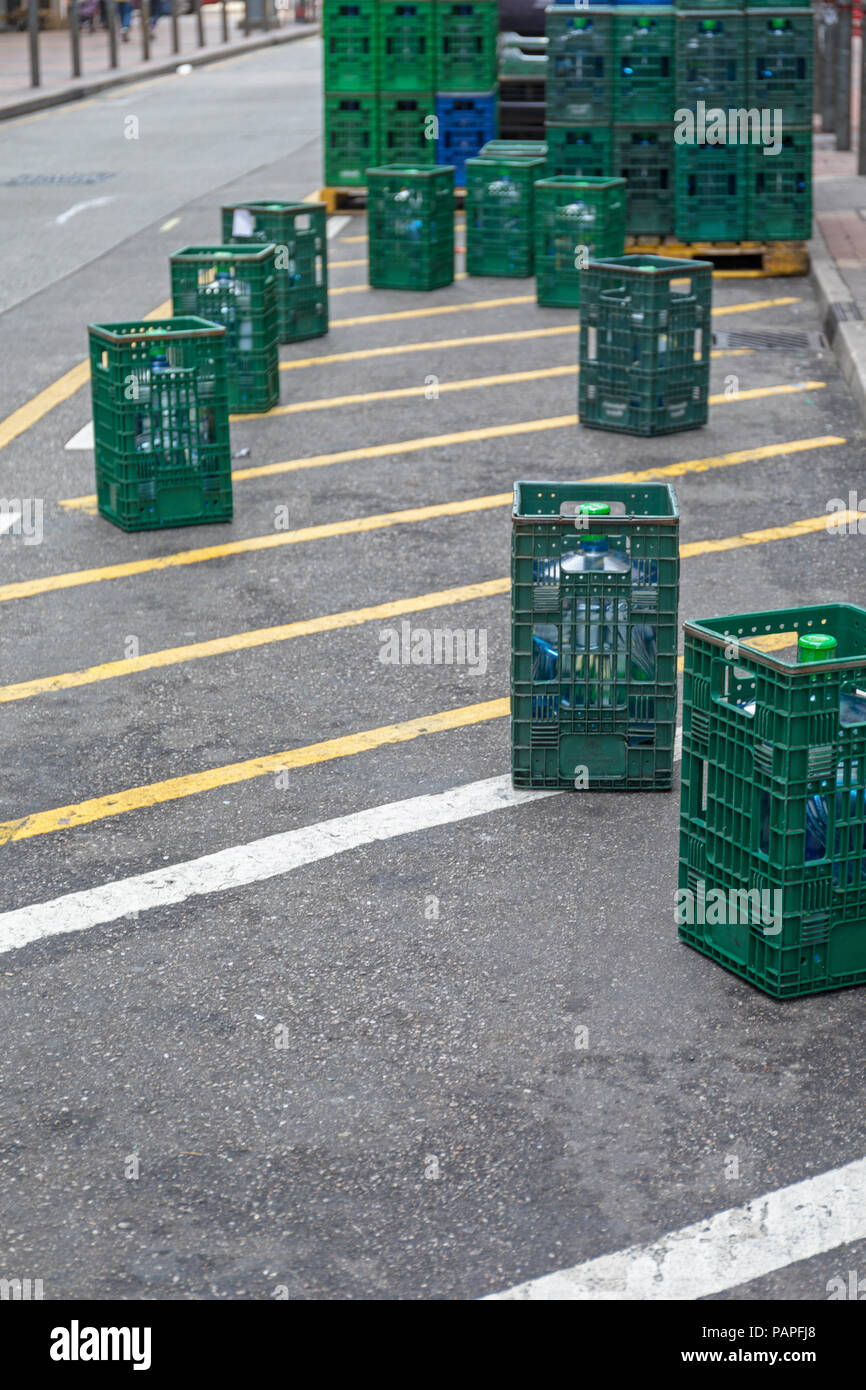 Water Cooler Bottles in Crates at Street Shipping Delivery Stock Photo