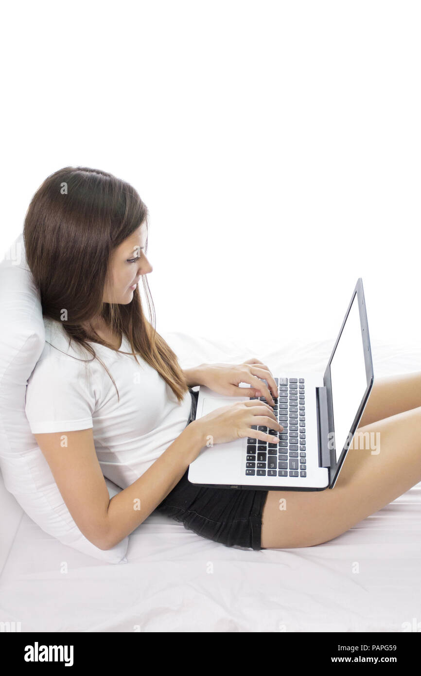 beautiful young girl working on her laptop at bedroom Stock Photo - Alamy