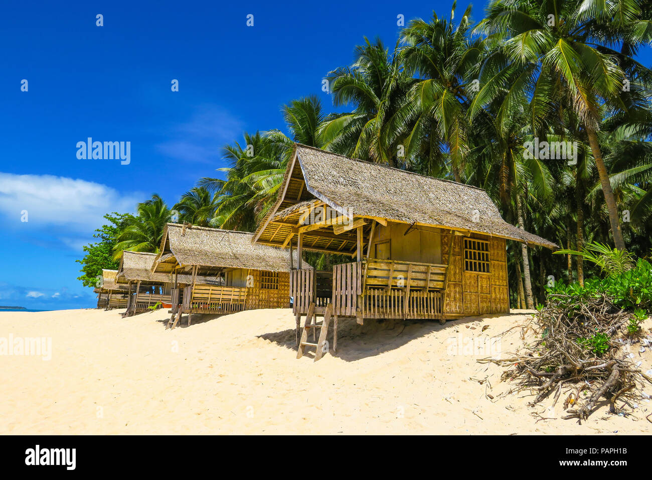 Bamboo Beach Huts In Tropical Paradise With Palm Trees And White Sand Daku Island Siargao Philippines Stock Photo Alamy