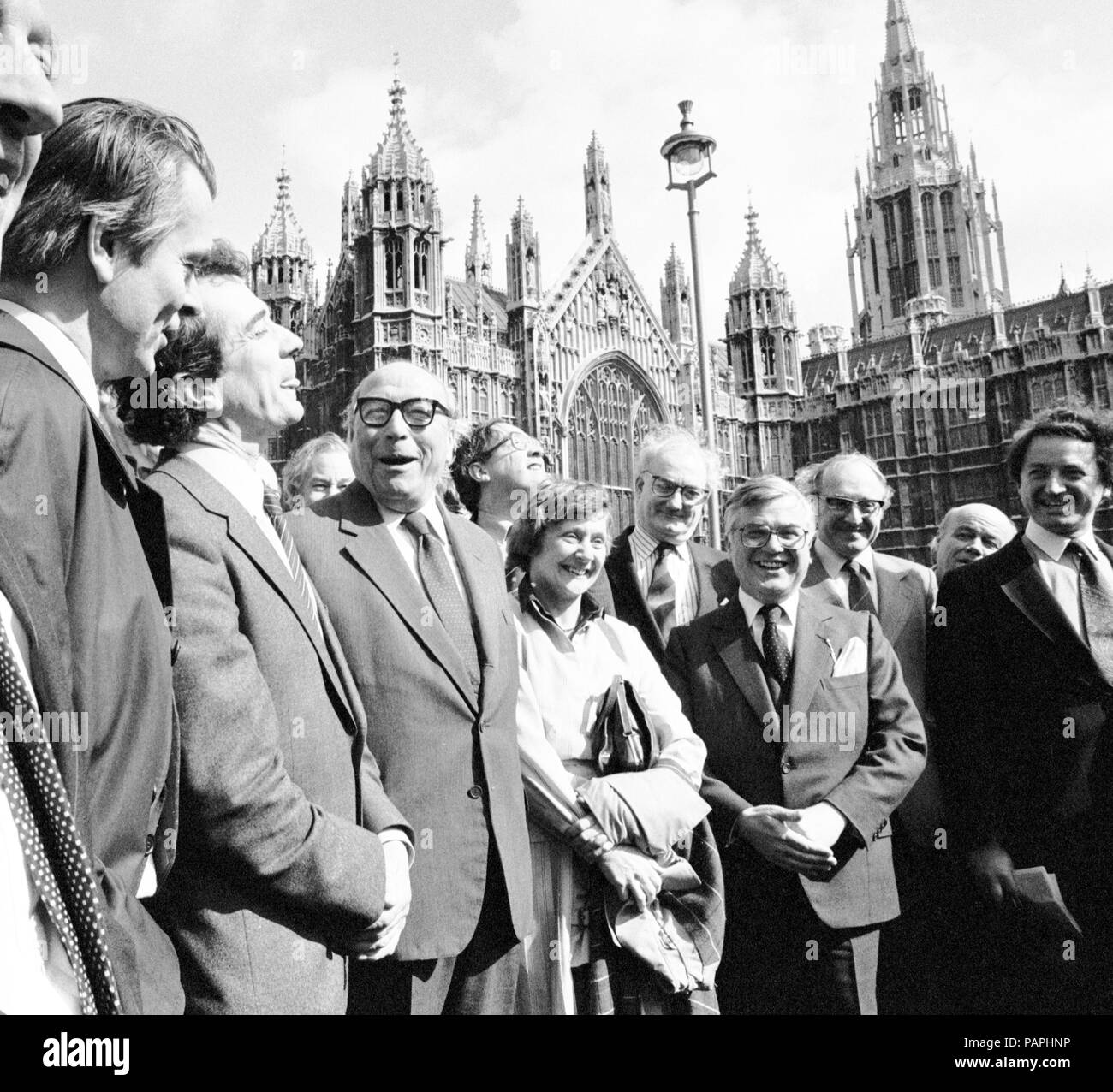 Flanked by co-founders of the SDP and surrounded by well-wishers, the Social Democratic Member of Parliament for Glasgow Hillhead, Mr Roy Jenkins (glasses, third left) arriving today to take up his seat in the Commons, won in last week's by-election. The co-founders (L-R) Dr David Owen, Mr William Rodgers, Mr Jenkins and Mrs Shirley Williams. Stock Photo