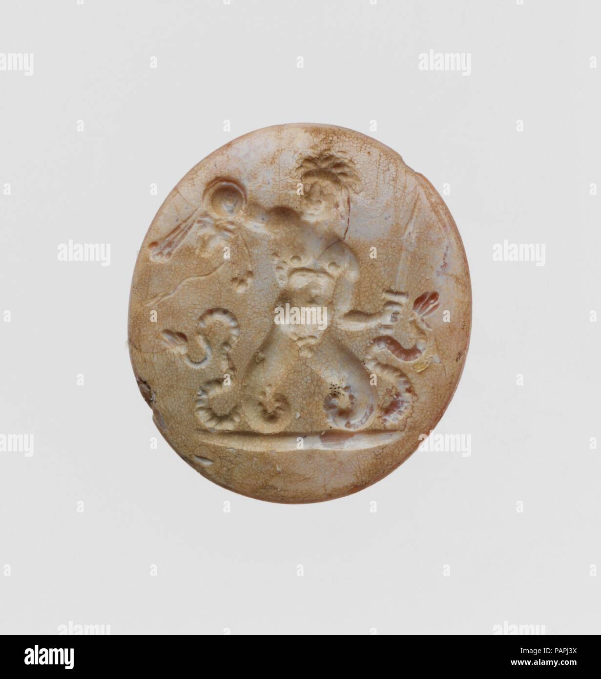 Carnelian ring stone. Culture: Roman. Dimensions: Length: 13/16 in. (2.1 cm). Date: ca. 1st century B.C.-3rd century A.D..  Young giant with serpent's legs. Museum: Metropolitan Museum of Art, New York, USA. Stock Photo