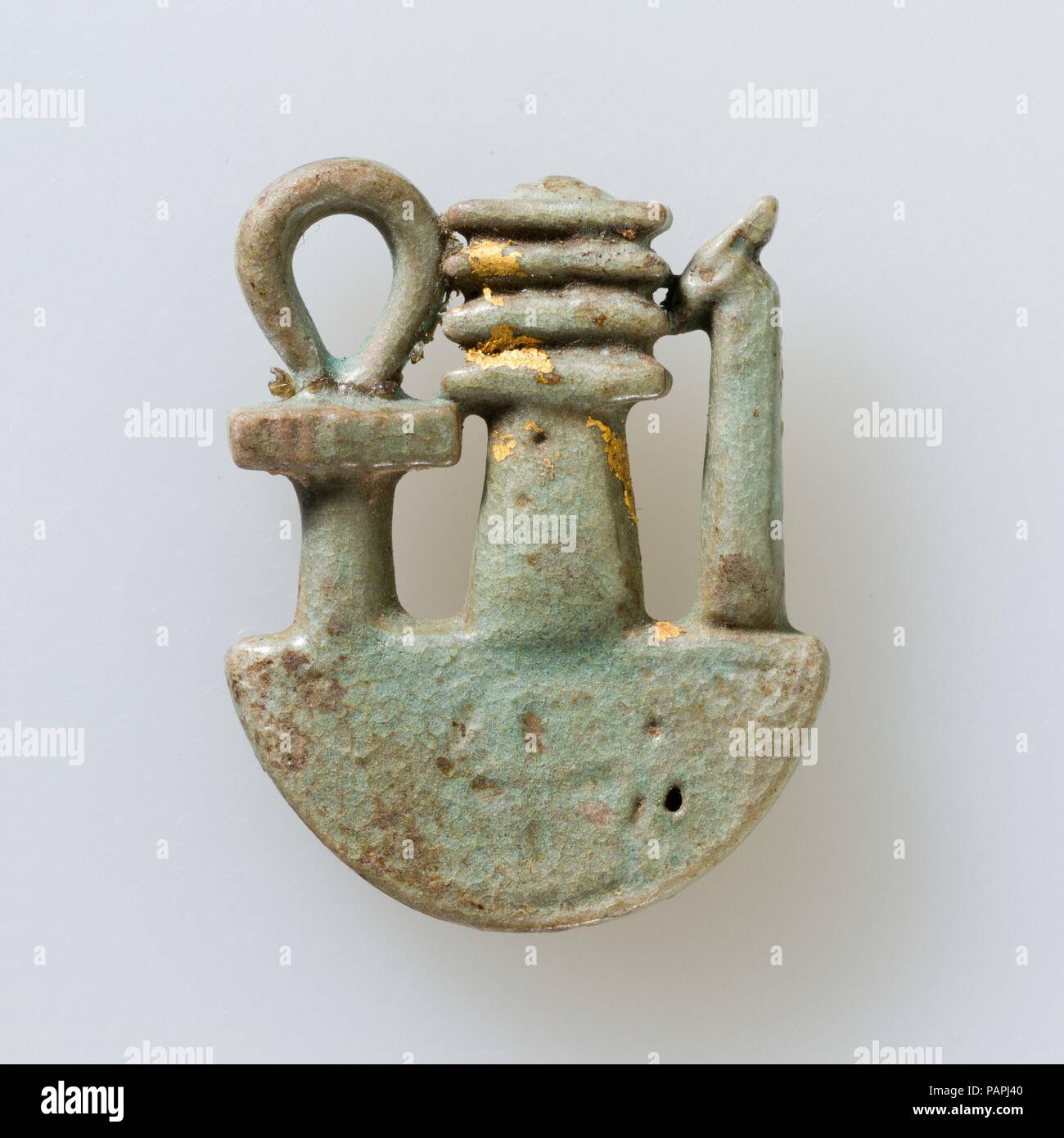 Ankh, djed, was on neb basket. Dimensions: L. 3 × W. 2.4 × D. 0.5 cm (1 3/16 × 15/16 × 3/16 in.). Date: 664-30 B.C..  The ankh (life), djed (stability), and was (dominion) symbols depicted here on the sign for a heb bowl constitute a powerful combination of wishes that was offered by the king to a god or a god to a king before the first millennium. Large complex inscribed examples of overlaid ankh, djed, and was elements from the time of the 25th and early 26th dynasty indicate the symbol is being associated with the Egyptian New Year, and one bears the name off Mentuemhat, the greatest offici Stock Photo