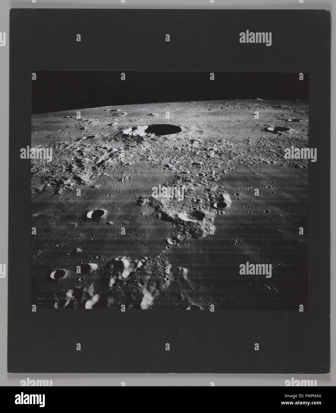The Moon - Crater Kepler and Vicinity. Artist: National Aeronautics and Space Administration (NASA). Dimensions: Image: 11 7/8 × 13 13/16 in. (30.2 × 35.1 cm)  Mount: 16 × 18 in. (40.6 × 45.7 cm). Printer: Eastman Kodak Co. (American). Date: 1967.  This photograph was made as part of the Lunar Orbiter program, a series of five unmanned spacecraft launched into orbit around the Moon in 1966 and 1967. Each spacecraft was equipped with a sophisticated imaging system provided by Eastman Kodak, which consisted of a dual-lens camera, film processing and handling units, and a readout scanner for tran Stock Photo