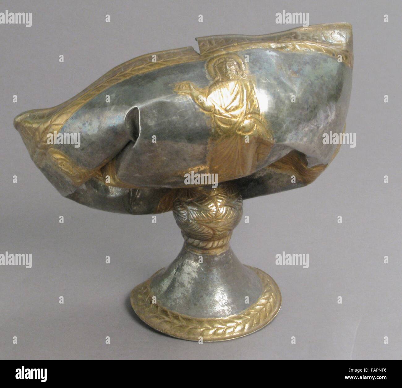 The Attarouthi Treasure - Chalice. Culture: Byzantine. Dimensions: Overall: 6 15/16 x 9 3/8 x 5 11/16 in. (17.6 x 23.8 x 14.4 cm)  Diam. of foot: 3 9/16 in. (9.1 cm)  Diam. of knop: 1 5/8 in. (4.2 cm). Date: 500-650.  These well-wrought liturgical objects-chalices, censers, a strainer, and a representation of the dove of the Holy Spirit-were among the possessions of a Christian church in the affluent merchant town of Attarouthi in Syria, then one of the richest lands of the Byzantine empire. The chalices, censers, and strainer were used for the Divine Liturgy, or Eucharist service, in which Ch Stock Photo
