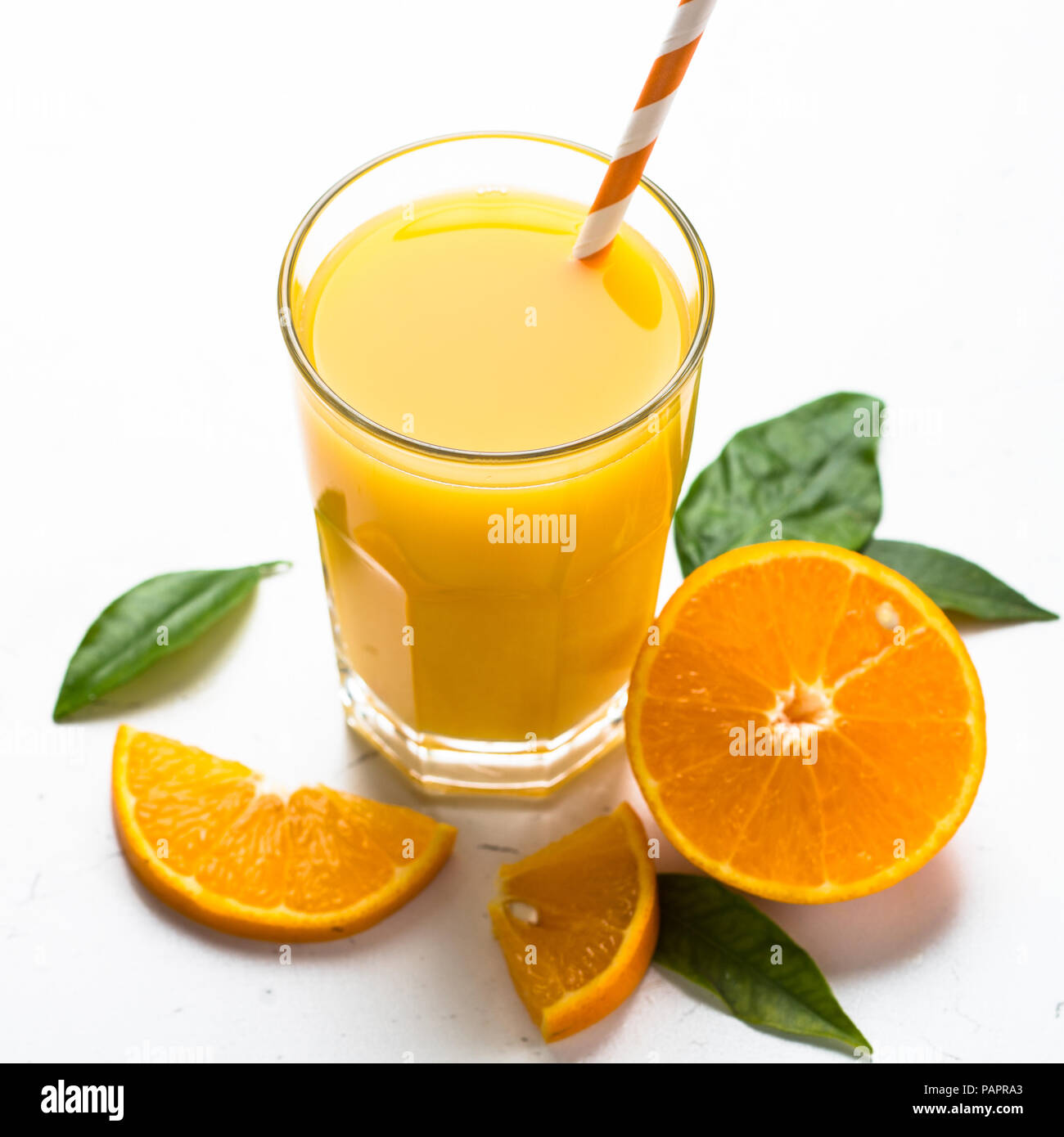 Orange juice in glass and fresh citrus around. Fresh orange juice