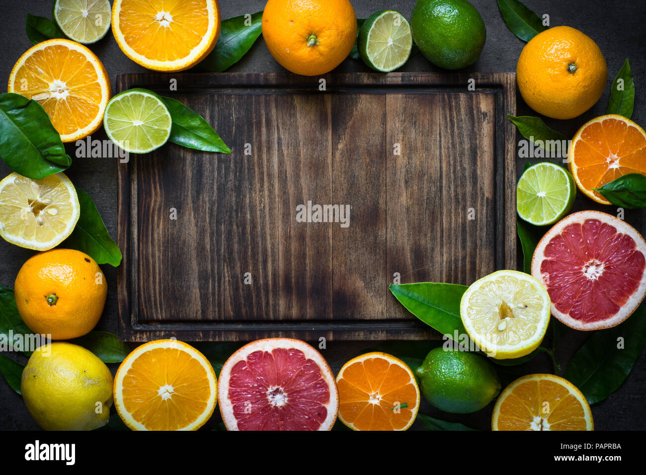 Fresh citrus fruit assortment. Different citrus fruit around cutting