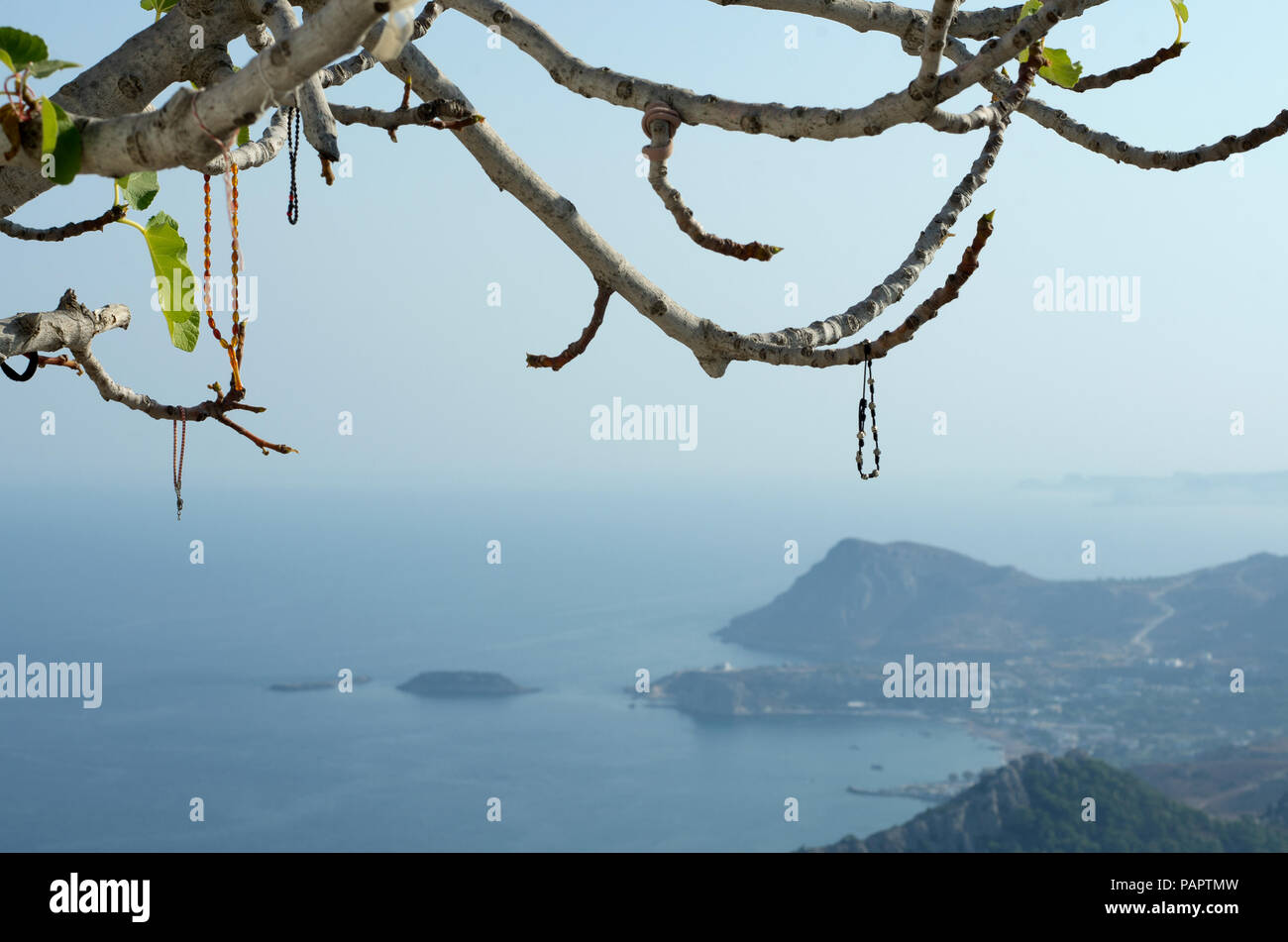 Bracelets dedicated to the virgin Mary Tsampika and left on the branches (Rhodes, Greece) Stock Photo