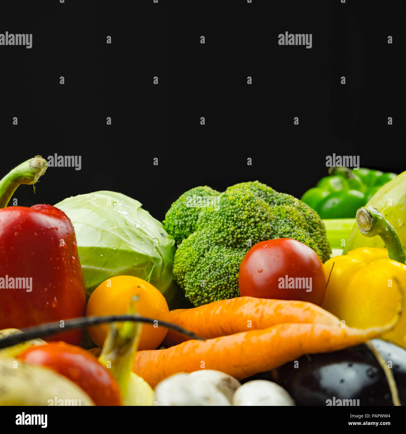 Close-up image of fresh organic vegetables, copy space composition. Locally grown bell pepper, corn, carrot, mushrooms and other natural vegan food la Stock Photo