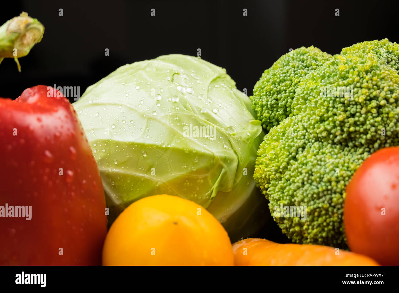 Close-up image of fresh organic vegetables. Locally grown cabbage, bell pepper, broccoli and other natural vegan food. Stock Photo