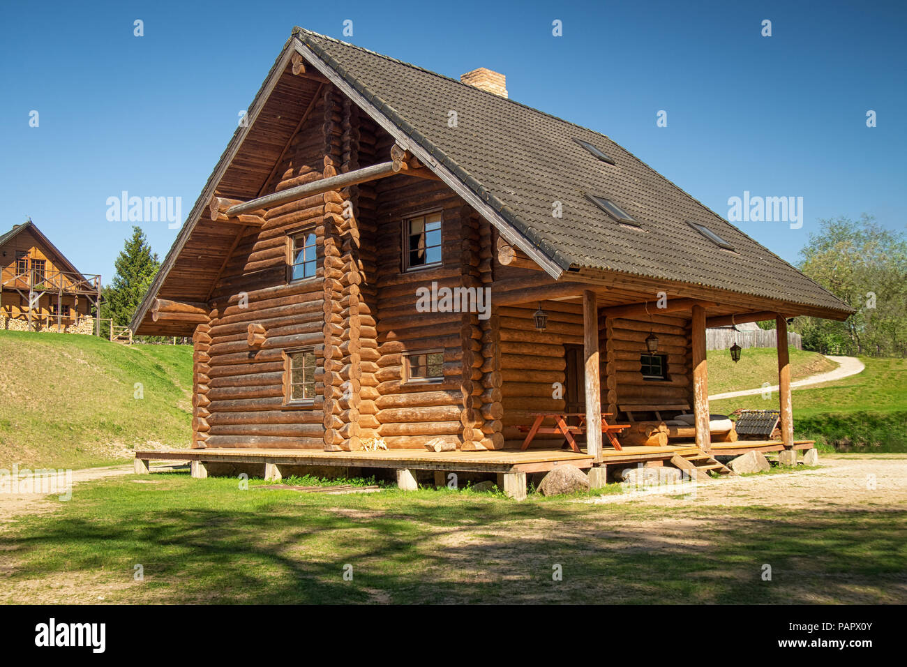 Log house in a country side in a sunny day Stock Photo