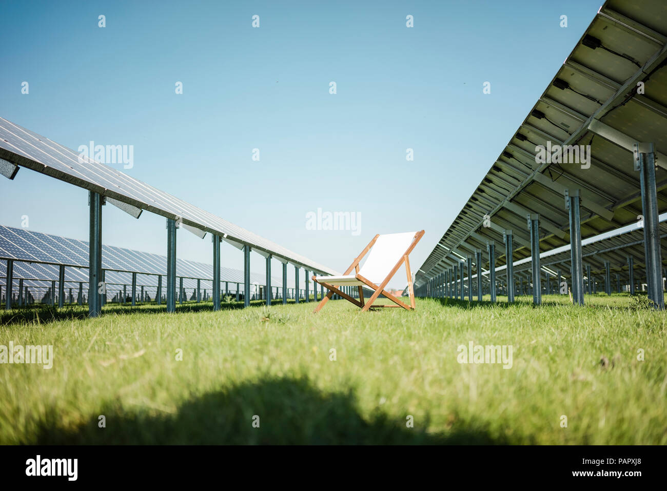 Germany, Kevelaer, solar plant and beach lounger Stock Photo