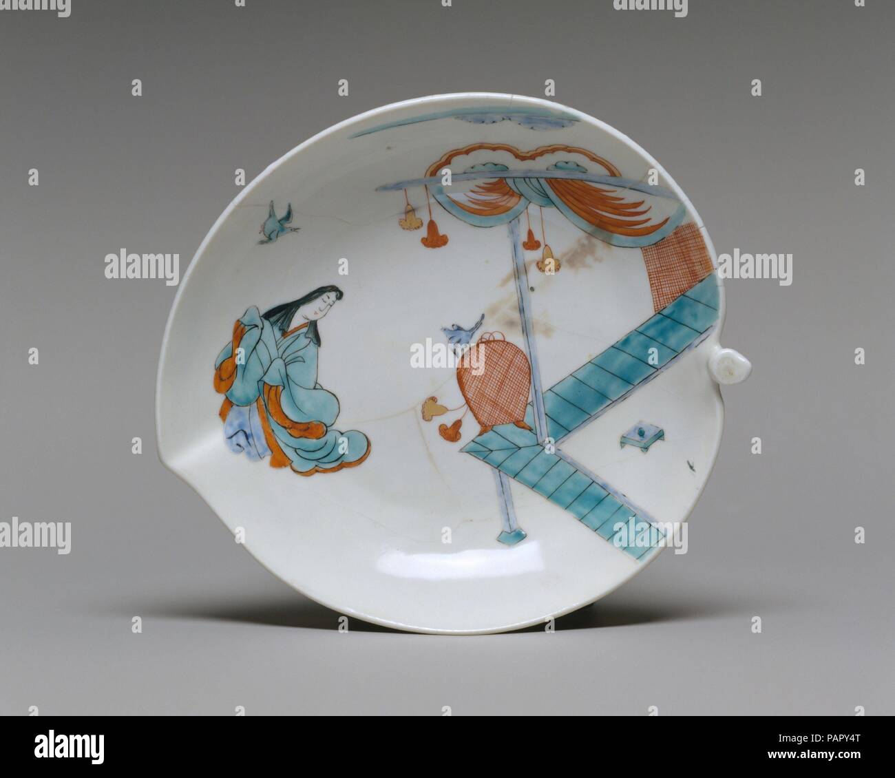 Dish with Japanese court woman and birds. Culture: British, Chelsea. Dimensions: Length: 8 in. (20.3 cm). Factory: Chelsea Porcelain Manufactory (British, 1745-1784). Date: ca. 1750.  The gift of the Hans Syz Collection in 1995 endowed the Museum with nearly three hundred examples of European and Asian ceramics meticulously acquired by Swiss-born collector Dr. Syz (1894-1991) to chart the migration of models and patterns from East to West. Documenting a continuous process of influence and adaptation, these pieces provide a discriminating review of the nuances of stylistic change resulting from Stock Photo