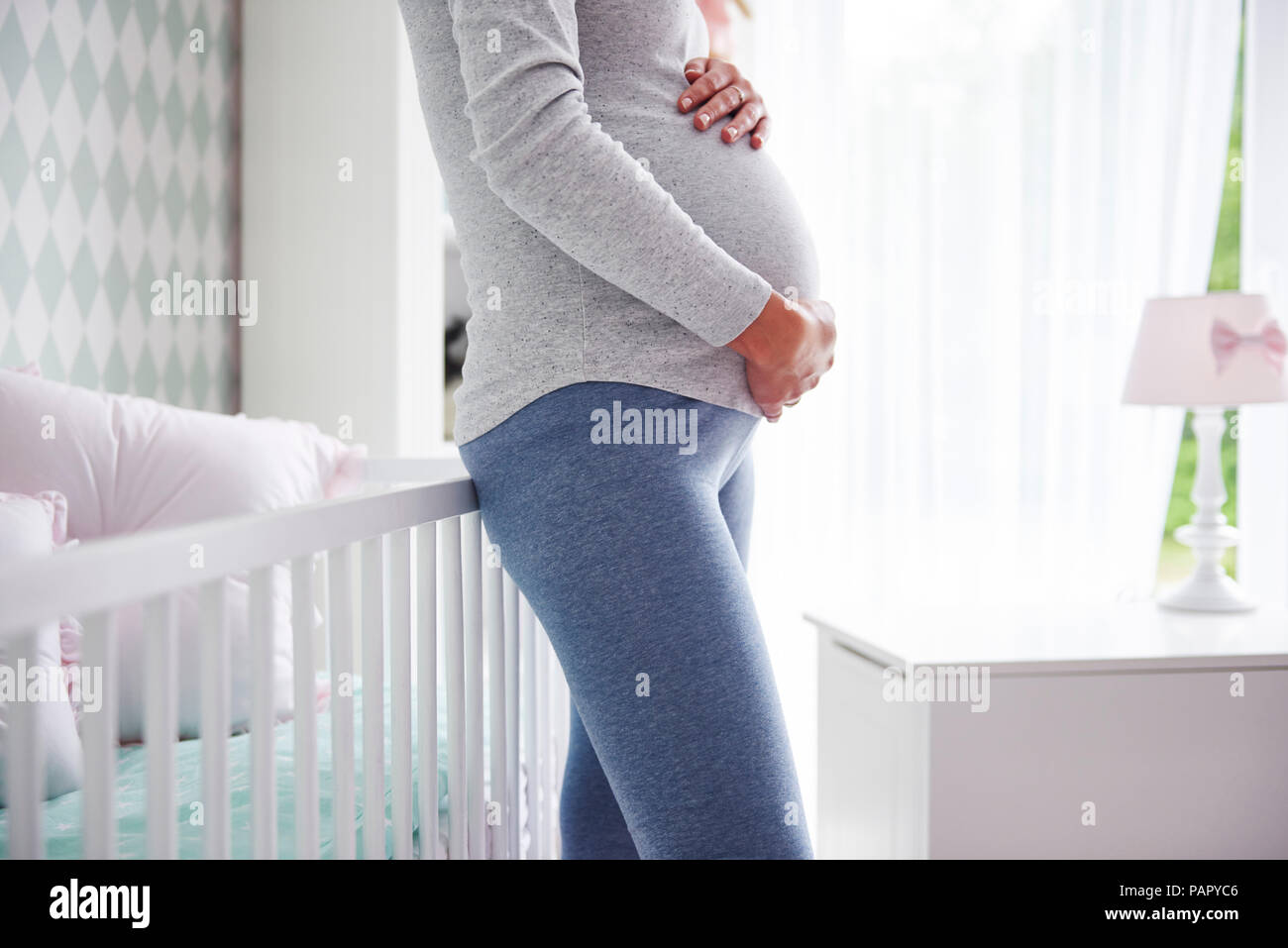 Pregnant woman holding baby belly Stock Photo