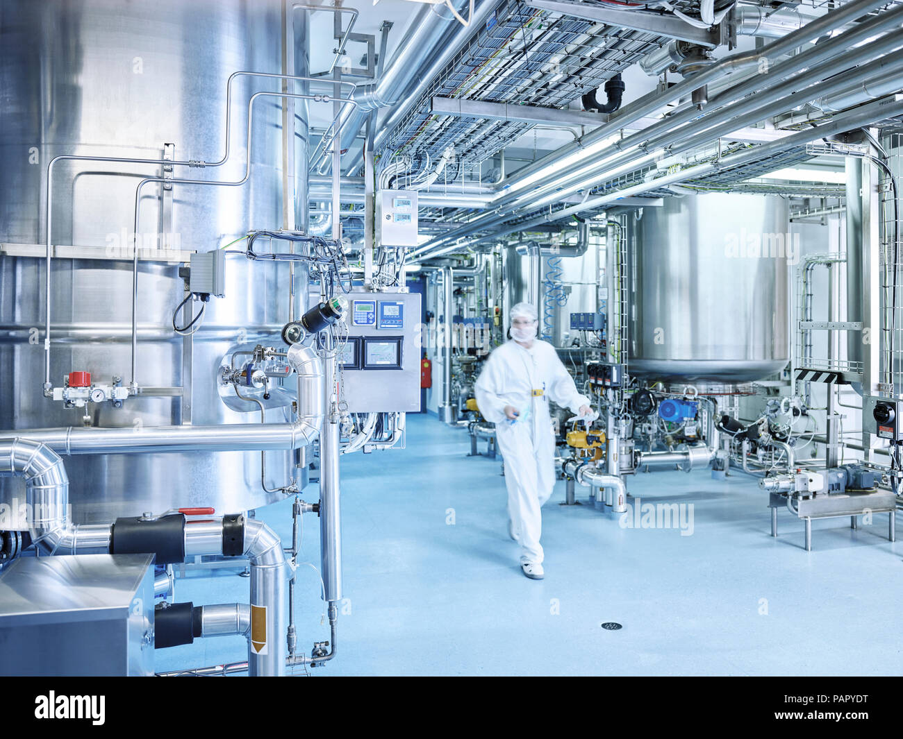 Chemist in a chemical factory Stock Photo