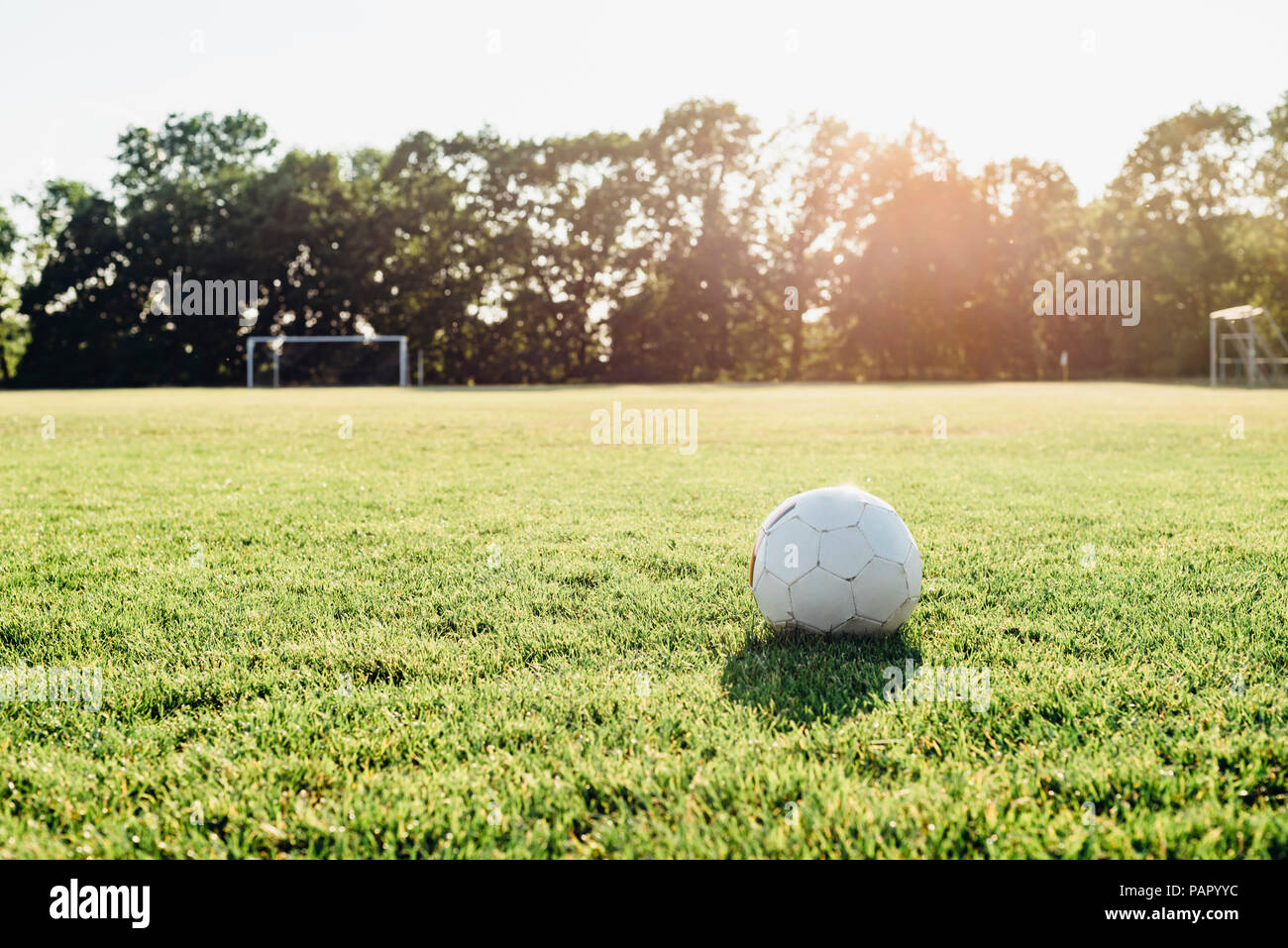 Soccer ball on soccer field Stock Photo