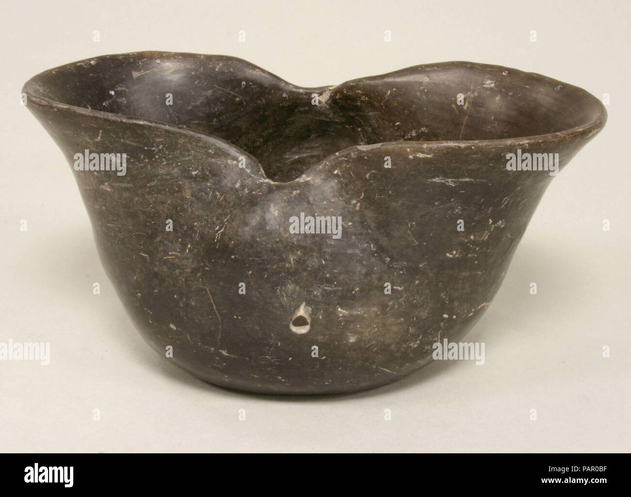 Bowl. Culture: Olmec (?). Dimensions: H. 3 7/16 x W. 7 x D. 4 5/8 in. (8.7 x 17.8 x 11.7 cm). Date: 3rd century B.C.-A.D. 4th century. Museum: Metropolitan Museum of Art, New York, USA. Stock Photo