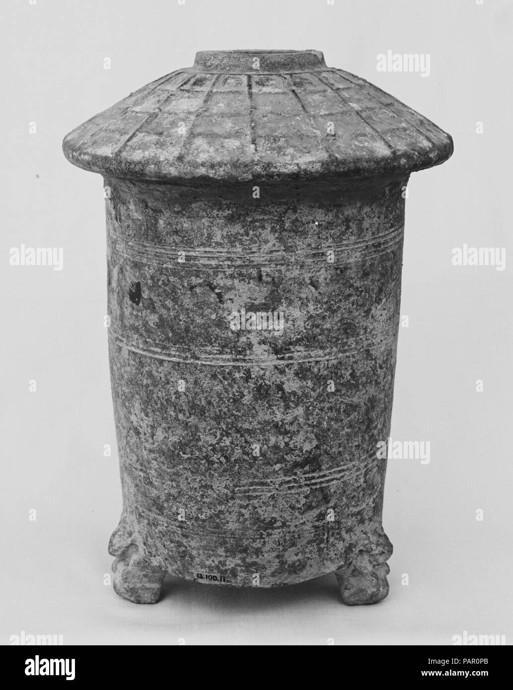 Granary Tower. Culture: China. Dimensions: H. 12 1/8 in. (30.8 cm); Diam. 8 1/4 in. (21 cm). Date: 1st-early 3rd century.  Pottery models of houses and farm structures were commonly included in Eastern Han burials to provide for the afterlife. Museum: Metropolitan Museum of Art, New York, USA. Stock Photo